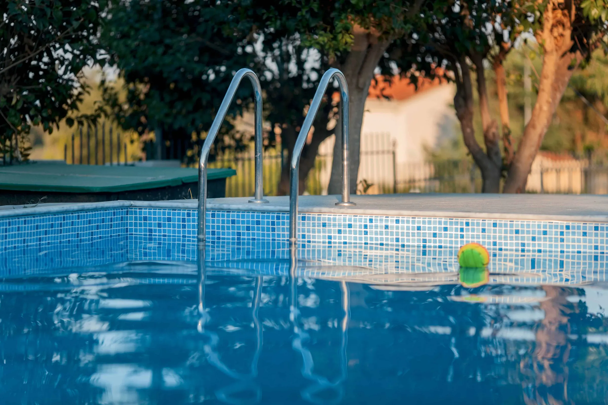 Blog hero photo for "What are the Benefits of a Pool?" — relevant completed pool/backyard project